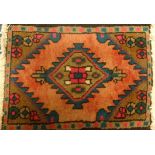 Three Eastern rugs the largest 158cm x 61cm, others 54cm x 40cm and 68cm x 55cm.