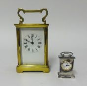 A brass cased carriage clock and a miniature clock (2).