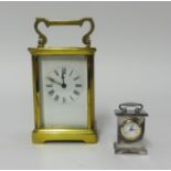 A brass cased carriage clock and a miniature clock (2).