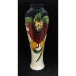 Moorcroft, a modern baluster shaped vase, 'Anna Lily', No.121/10, circa 1998, height 27cm, boxed.