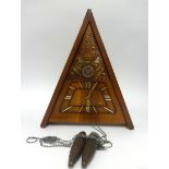 A reproduction Masonic style triangle wall clock.