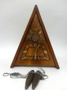 A reproduction Masonic style triangle wall clock.