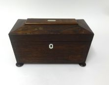 A 19th Century rosewood tea caddy, containing a note dated 1902 from an 'Elisabeth Glober'