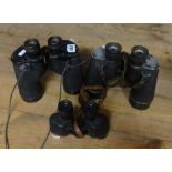 Three pairs of WWII binoculars including 1944 Canadian, 1943 US Navy and US Army.