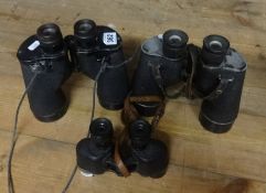 Three pairs of WWII binoculars including 1944 Canadian, 1943 US Navy and US Army.