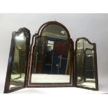A early 20th Century three fold dressing table mirror, veneered in tortoishell with carved bone