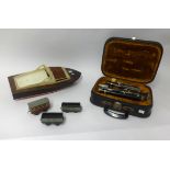A clarinet with fitted case together with tin plate 0 gauge railway track and model boat (a
