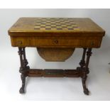 A Victorian walnut fold over Games and Work Table.