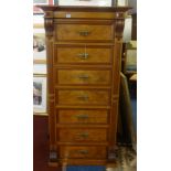 A burr walnut and figured walnut Wellington Chest fitted with seven drawers and lockable right