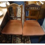 Five Edwardian mahogany carved chairs (a set of three and two).