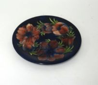 W. Moorcroft, poppies plate, diameter 25cm, monogrammed in blue, impress marks.