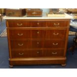 A Continental mahogany chest of drawers with marble top.