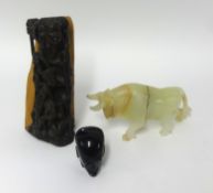 An onyx buffalo carving, a carved wood African figure group and a polished onyx figure (3).