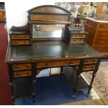 A Victorian ebonised and walnut writing table in the aesthetic style.