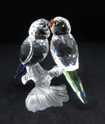 1Swarovski, a pair of Budgies on a frosted perch with blue and green tails, boxed.