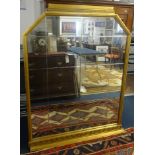 An Art Deco and Odeon style gilt framed mirror.