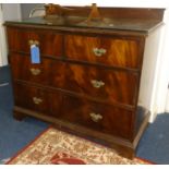 A low mahogany chest fitted with two short and two long drawers, with glass cover, width 105cm