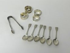 A set of six Georgian silver teaspoons, pair of Victorian silver sugar tongs, four silver napkin