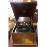 A vintage HMV wind up table top and mahogany cased gramophone.