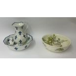 A four piece blue and white jug and basin set together with a part floral toilet set.