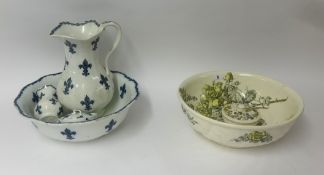 A four piece blue and white jug and basin set together with a part floral toilet set.