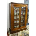 A mahogany free standing two drawer glazed book case, width 98cm (possibly upper section to a larger