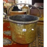 An antique brass bound bucket, height excluding handle 25cm.