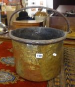 An antique brass bound bucket, height excluding handle 25cm.