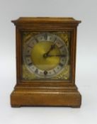 An oak bracket clock, the movement signed 'W & D', with a gilt dial, height 23cm.