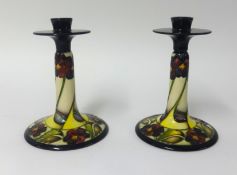 Moorcroft, a pair of candlesticks, 'The Dames Pansy', 850/9 by P.Harrison.
