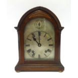A early 20th Century walnut cased bracket clock inscribed 'Michell, Penzance', height 25cm.