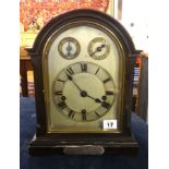 A early 20th Century bracket clock with striking and chiming movement on gongs with presentation