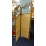 An early 20th century gilt framed, glazed and part upholstered three fold full length dressing