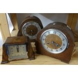 Six early 20th Century oak and walnut cased mantel clocks.