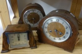 Six early 20th Century oak and walnut cased mantel clocks.