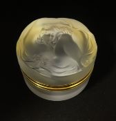 Lalique, France, Daphne, a glass powder box, signed 'Lalique, France', diameter 75mm.