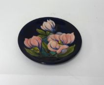 W. Moorcroft, plate, magnolia, monogrammed WM, impress marks, diameter 25cm.