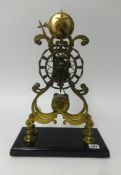 A 19th century skeleton clock, with striking movement, fusee, on rectangular plinth (no dome),