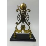 A 19th century skeleton clock, with striking movement, fusee, on rectangular plinth (no dome),