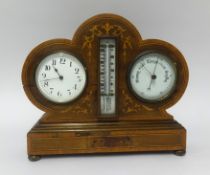 A combination Edwardian clock, barometer and thermometer set in a marquetry inlaid