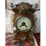 A French mahogany cased clock with ornate gilt decoration including cherub finial, movement detached