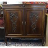 French two door carved hardwood cabinet, width 129cm.