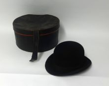 A old bowler hat, of London, also an unusual shell album of pressed flowers.