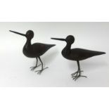 A pair of primitive carved wood standing birds, height 22cm.