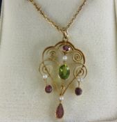 An antique 15ct gold peridot, pink tourmaline and pearl scrolled wire pendant and chain, circa 1900,