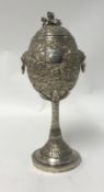 Chinese Export Silver, a Challenge Cup, richly embossed decorated with various scenes including