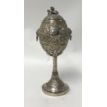 Chinese Export Silver, a Challenge Cup, richly embossed decorated with various scenes including