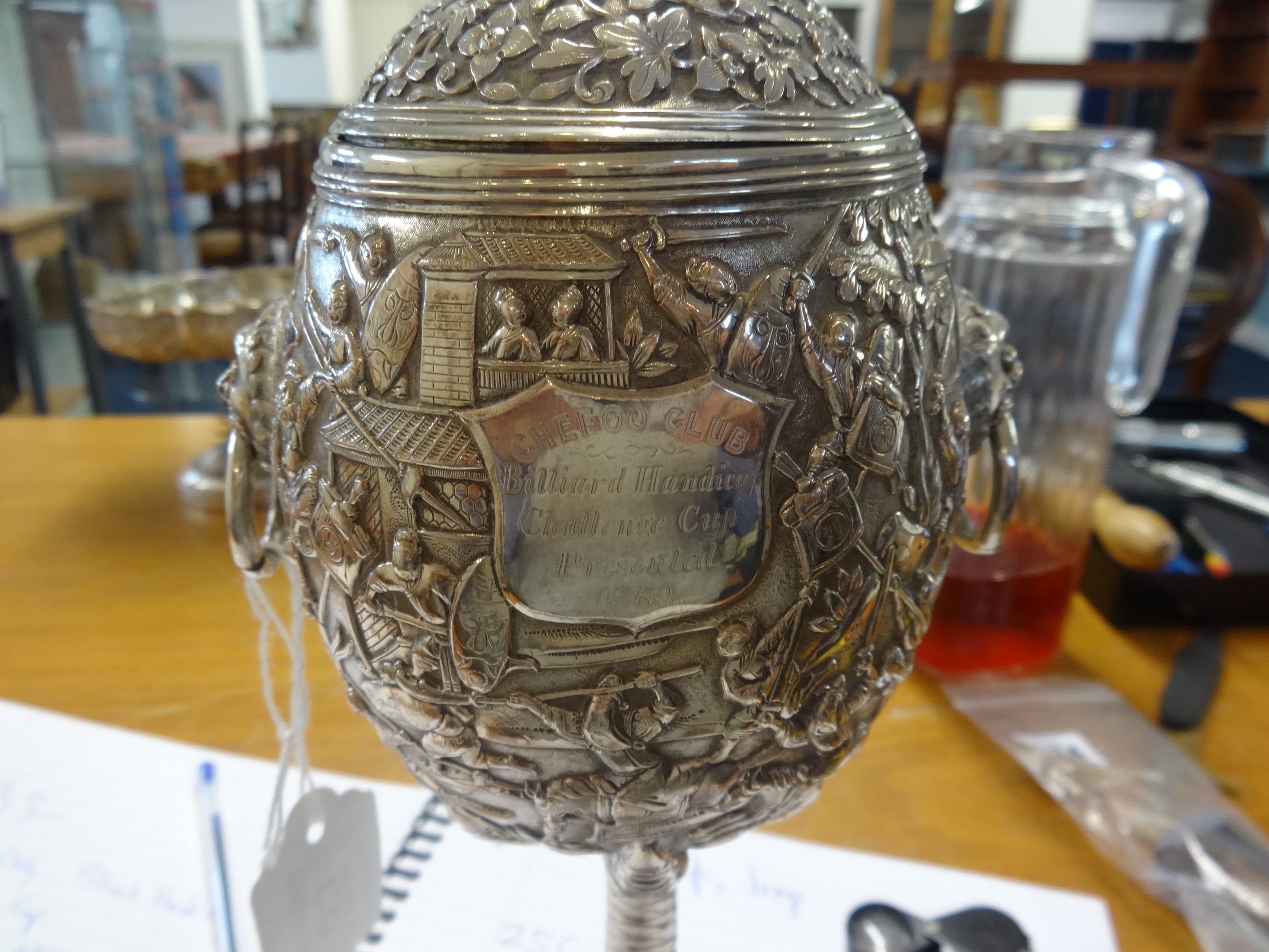 Chinese Export Silver, a Challenge Cup, richly embossed decorated with various scenes including - Image 6 of 10