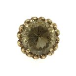 A large smokey quartz high set gold ring, (believed to be 14k set), weight 16.40gms, finger size R.