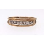A 9ct half band diamond set eternity ring, finger size N.